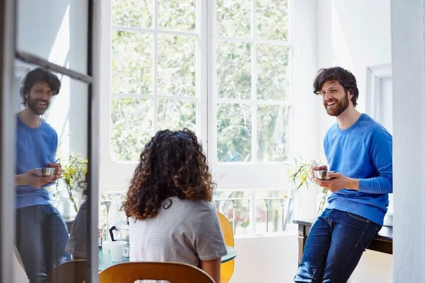 colleagues casually chatting in light-filled office