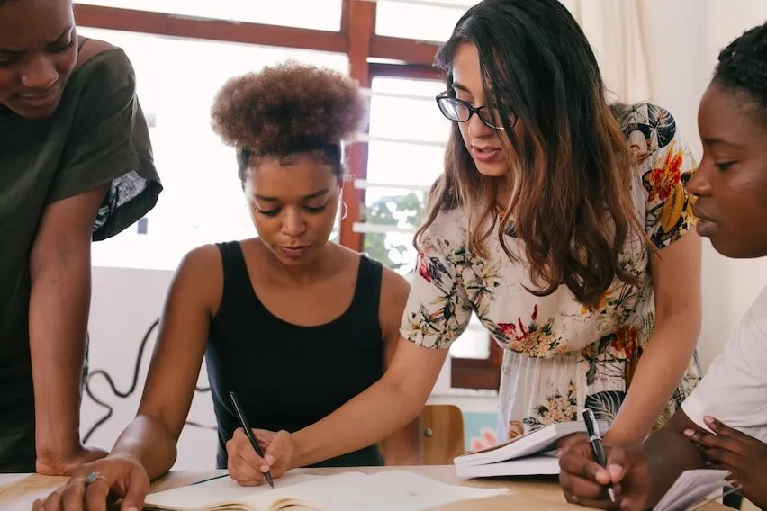 how to build a team with team of 4 women meeting